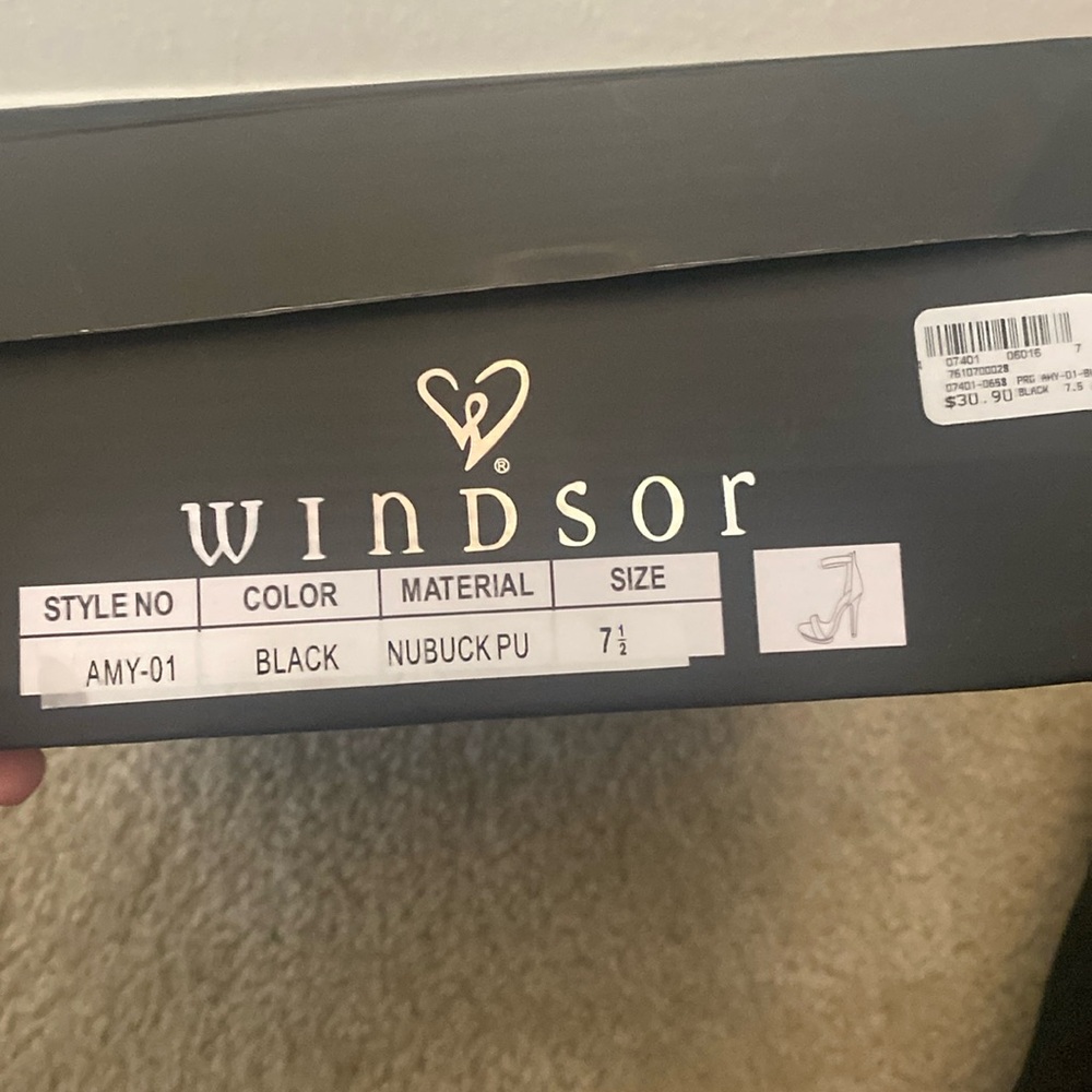 Brand new never worn, only tried on in store! 
7.5 Black peep toe high heel!